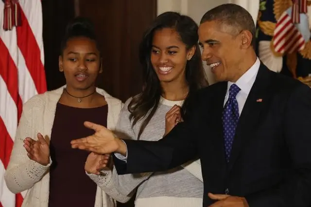 The president and his daughters at the turkey pardon
